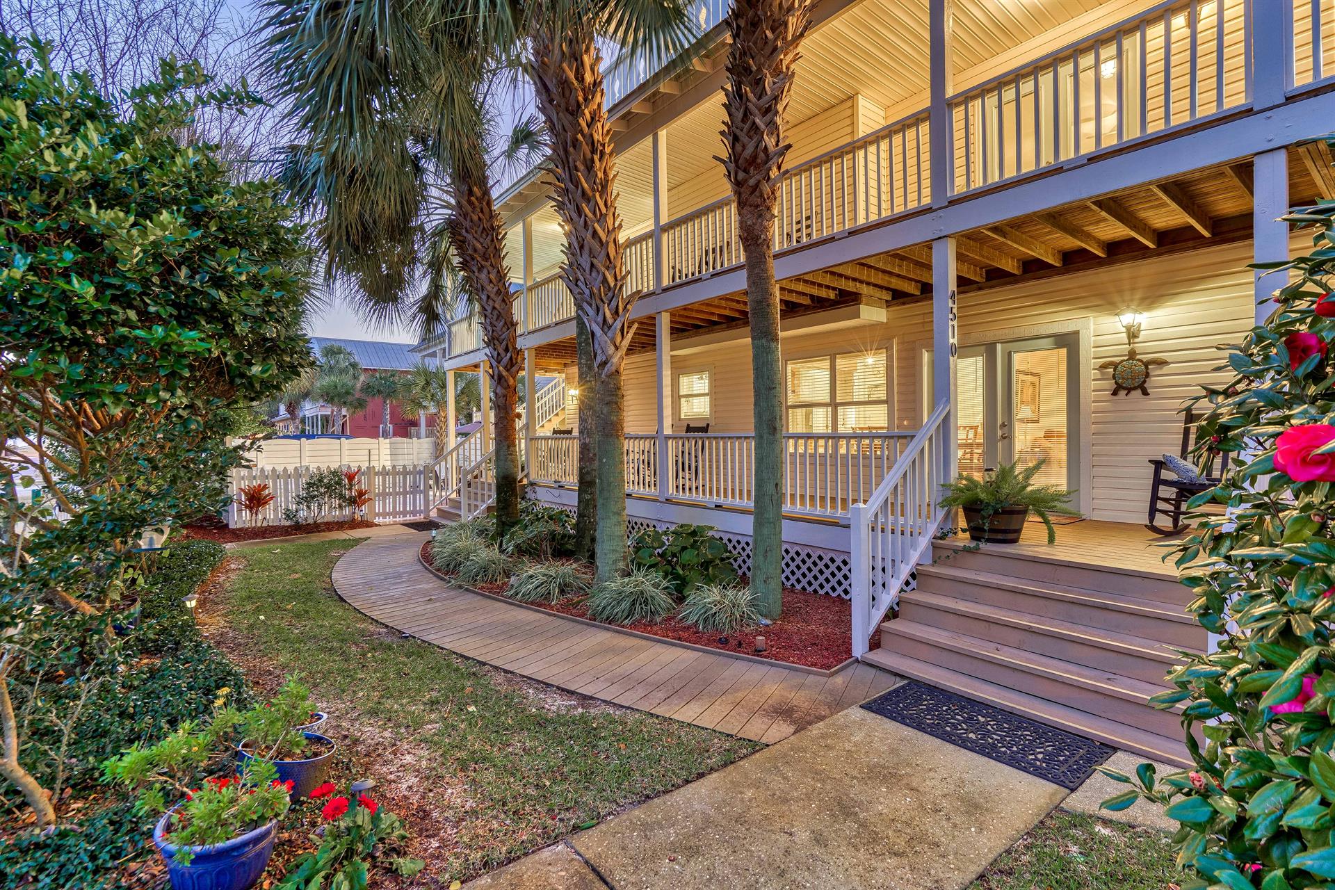 Beautiful Wraparound porches with plenty of seating and lush landscaping.