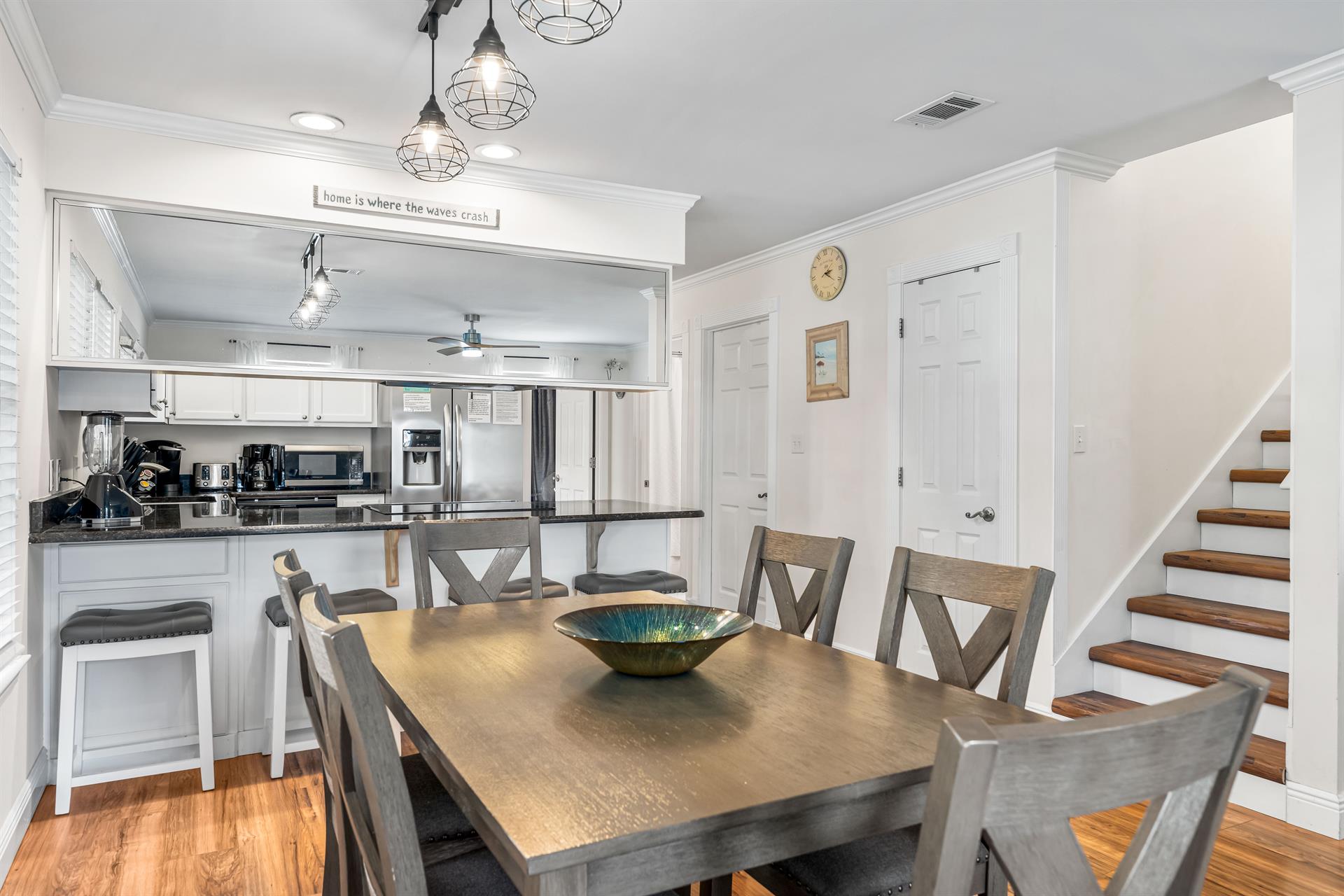 Seating at the dining table for 6 with 4 bar stools.