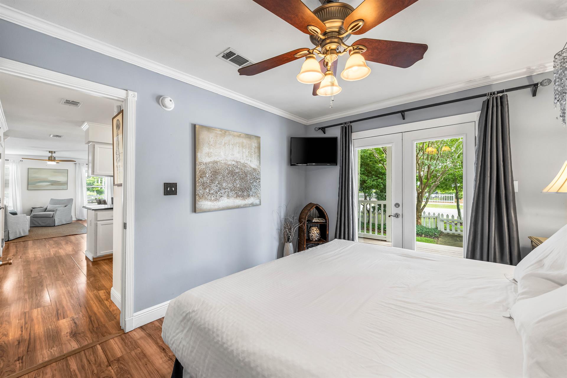 King Bedroom 1 on first floor with porch access and 32 smart tv