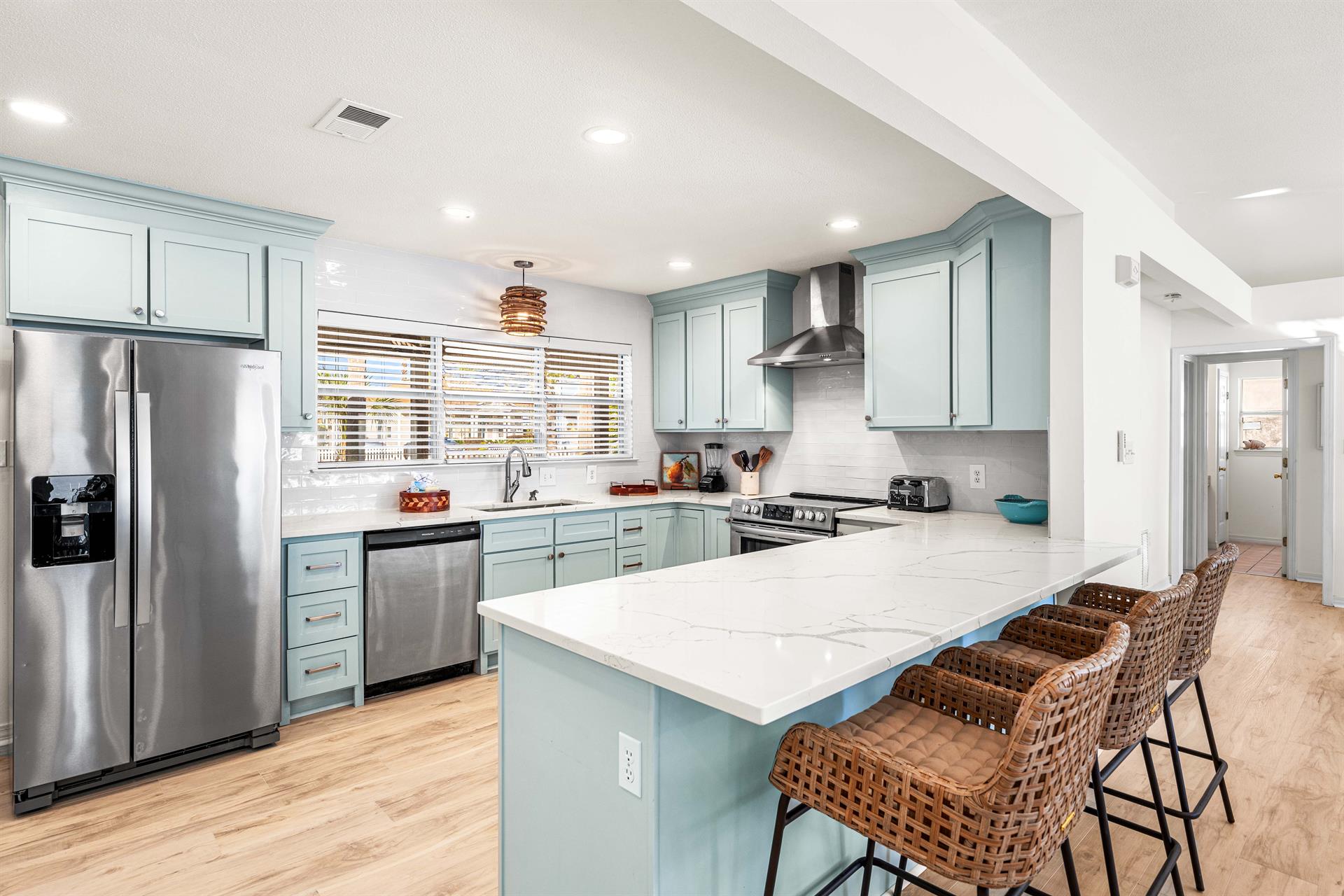 Quartz Counters with Stainless Steel Appliances and Seating for 3.