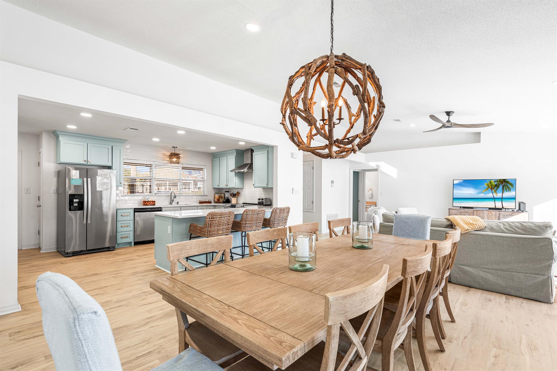 This Dining Table can Handle the Entire Group Seating 10 Plus 3 More on the Kitchen Bar and a Pool View