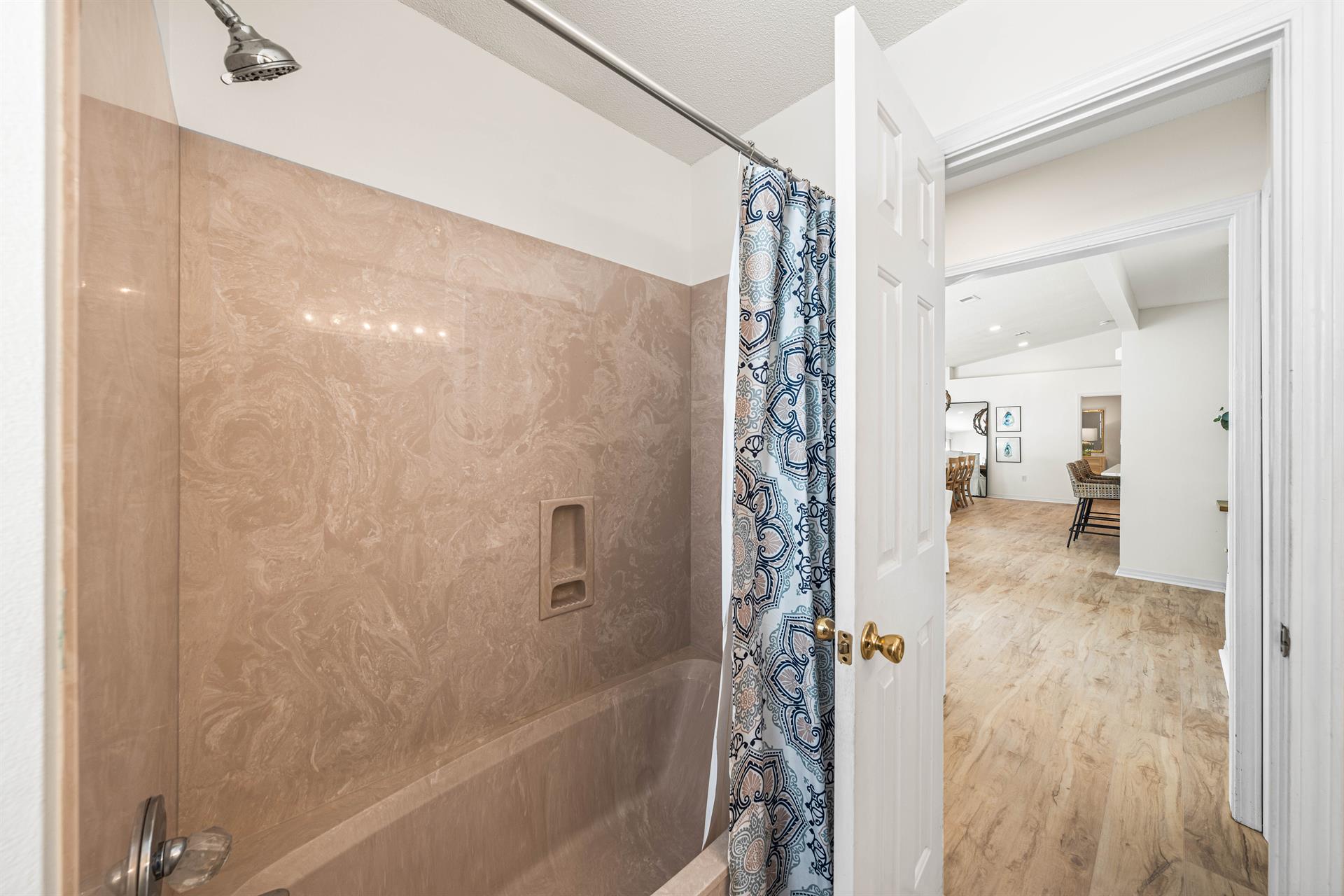 Both the Bunkroom and Guest King Bedroom Share this Single Vanity Bathtub and Shower Combination.