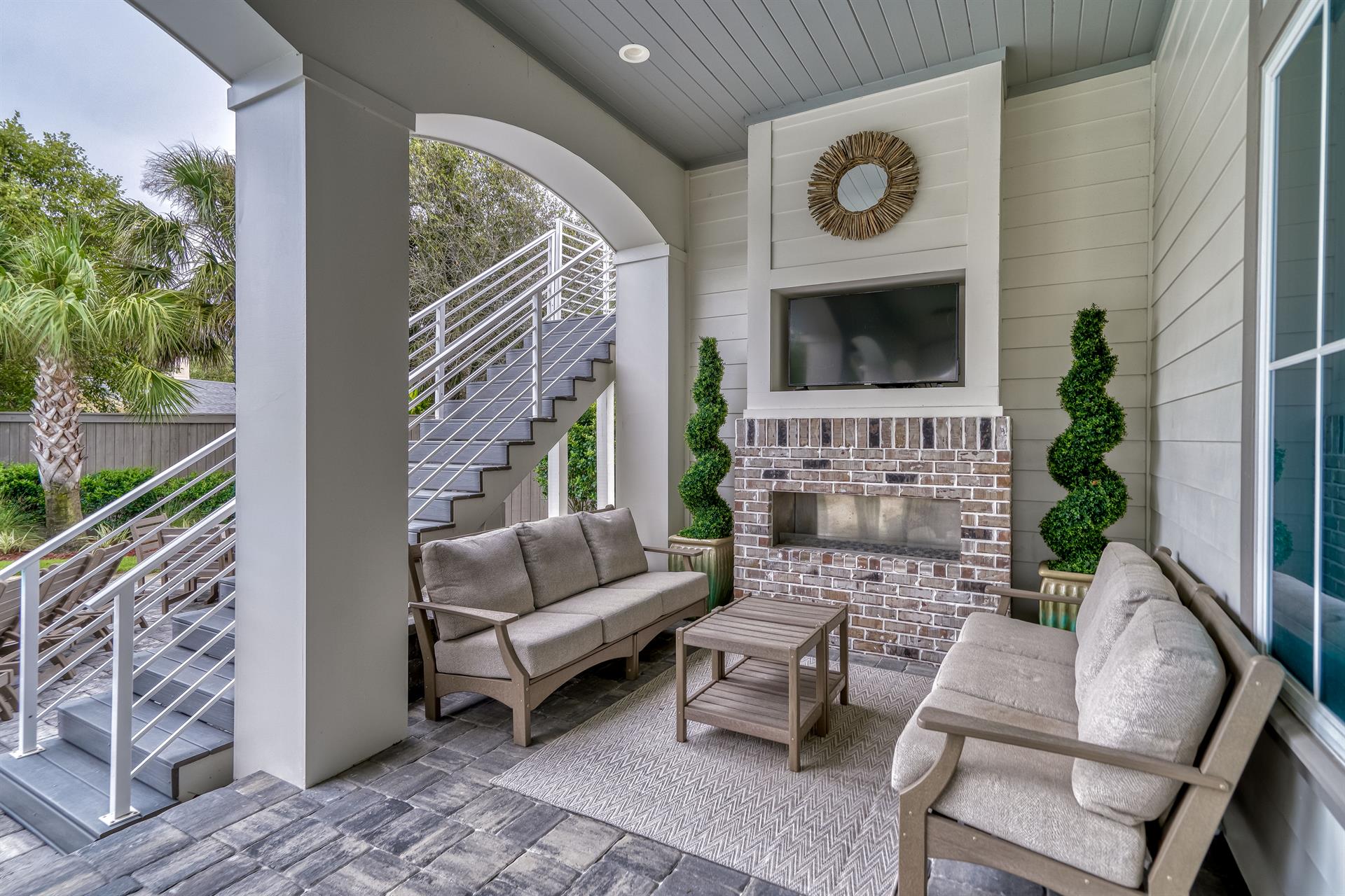 Outdoor Living Area with Fireplace and Flat Screen Television