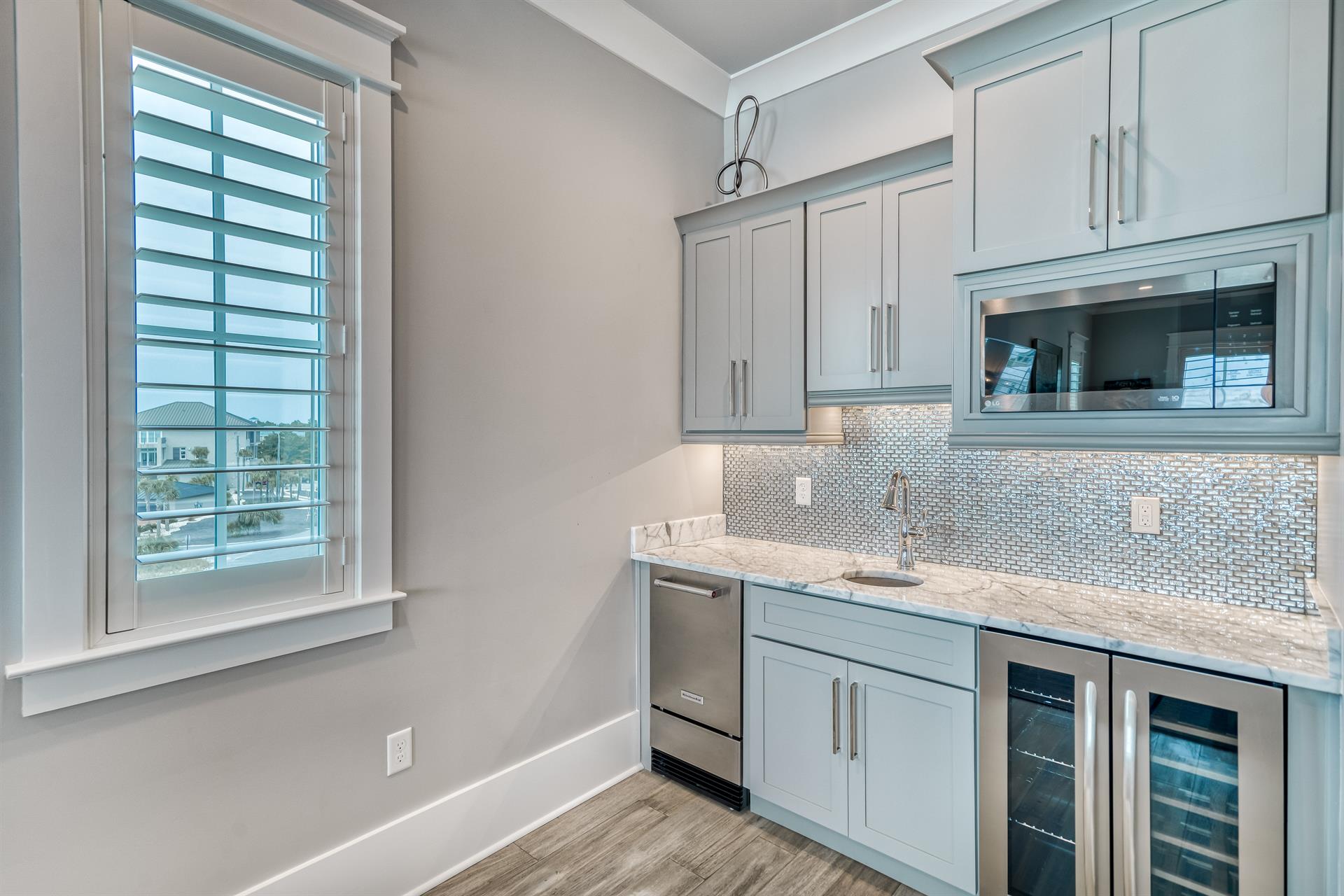 Third floor media room kitchenette.