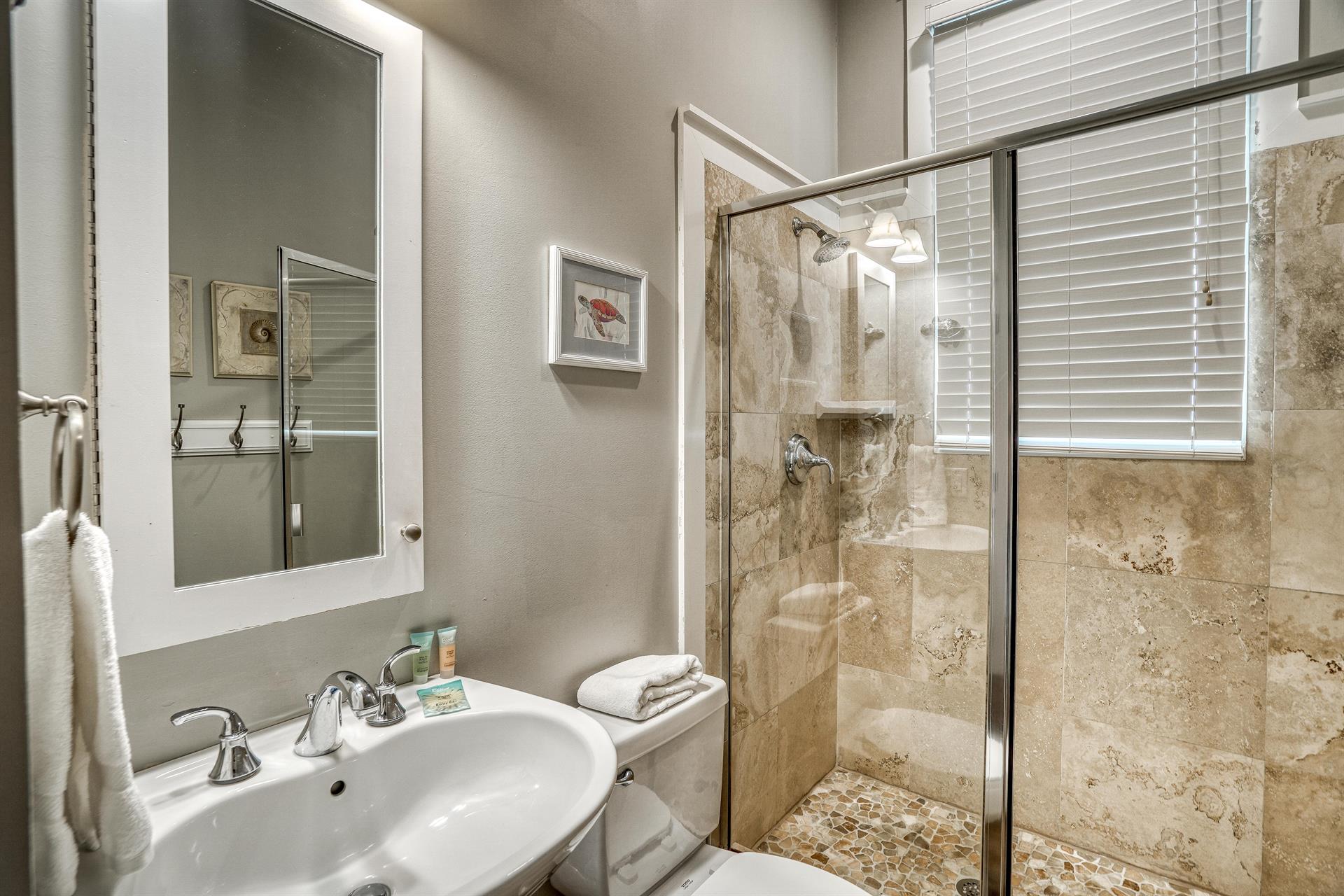 Access this convenient first floor full bathroom with walkin shower from the hallway or the queen bedroom.
