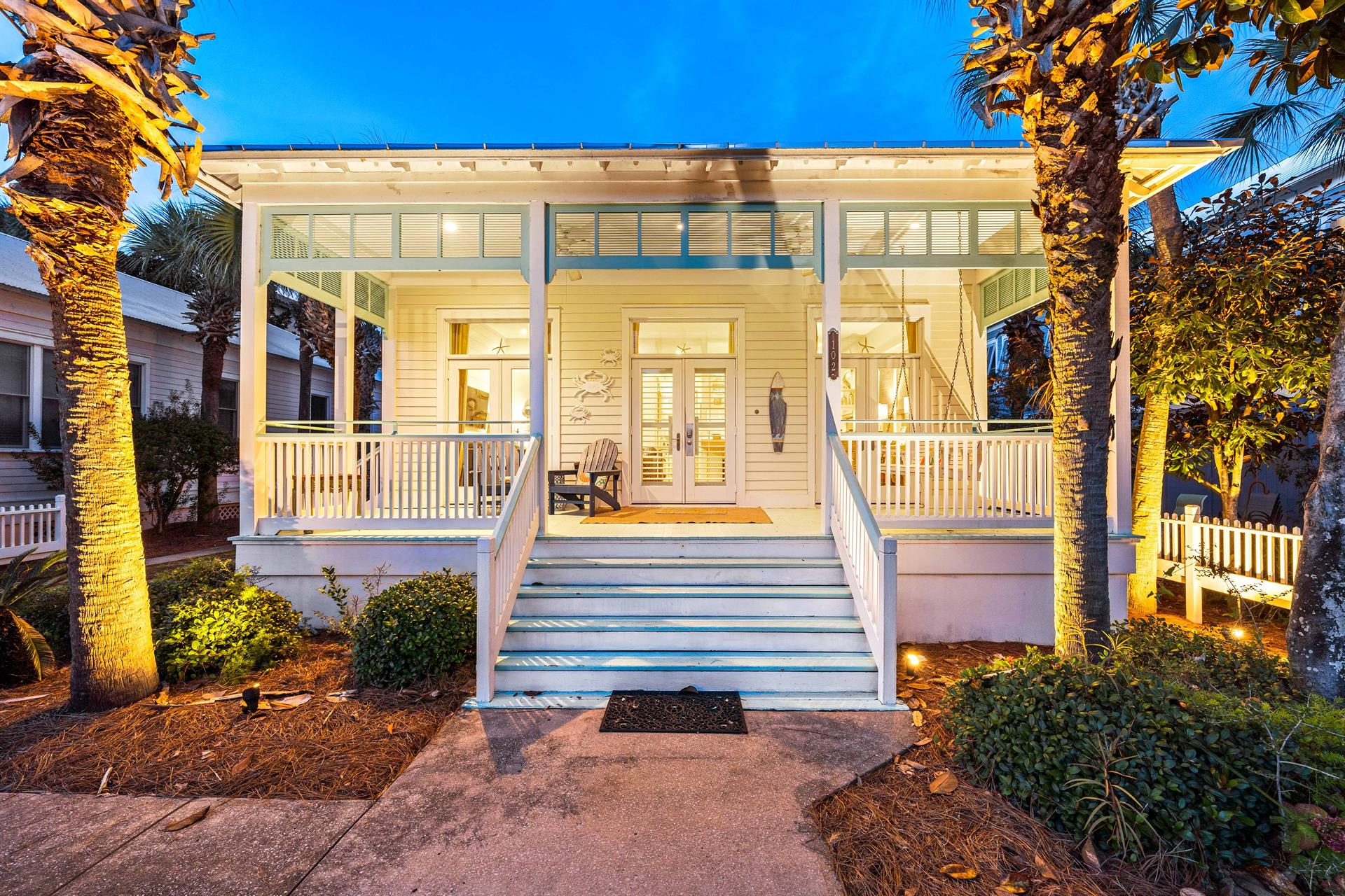 A welcoming classic coastal cottage with hardwood floors, high ceilings, front porch  ceiling fans throughout.