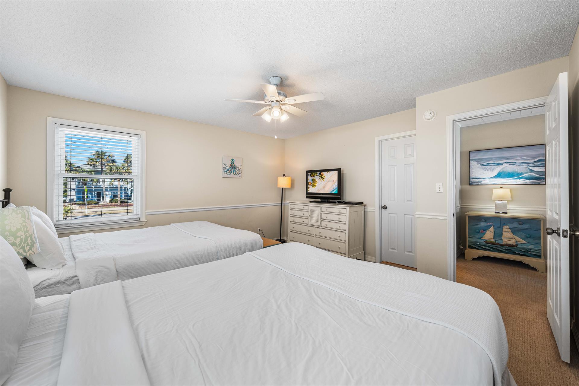 Enjoy a breeze from the overhead ceiling fan while watching a show on this 31 flat  screen tv with cable.