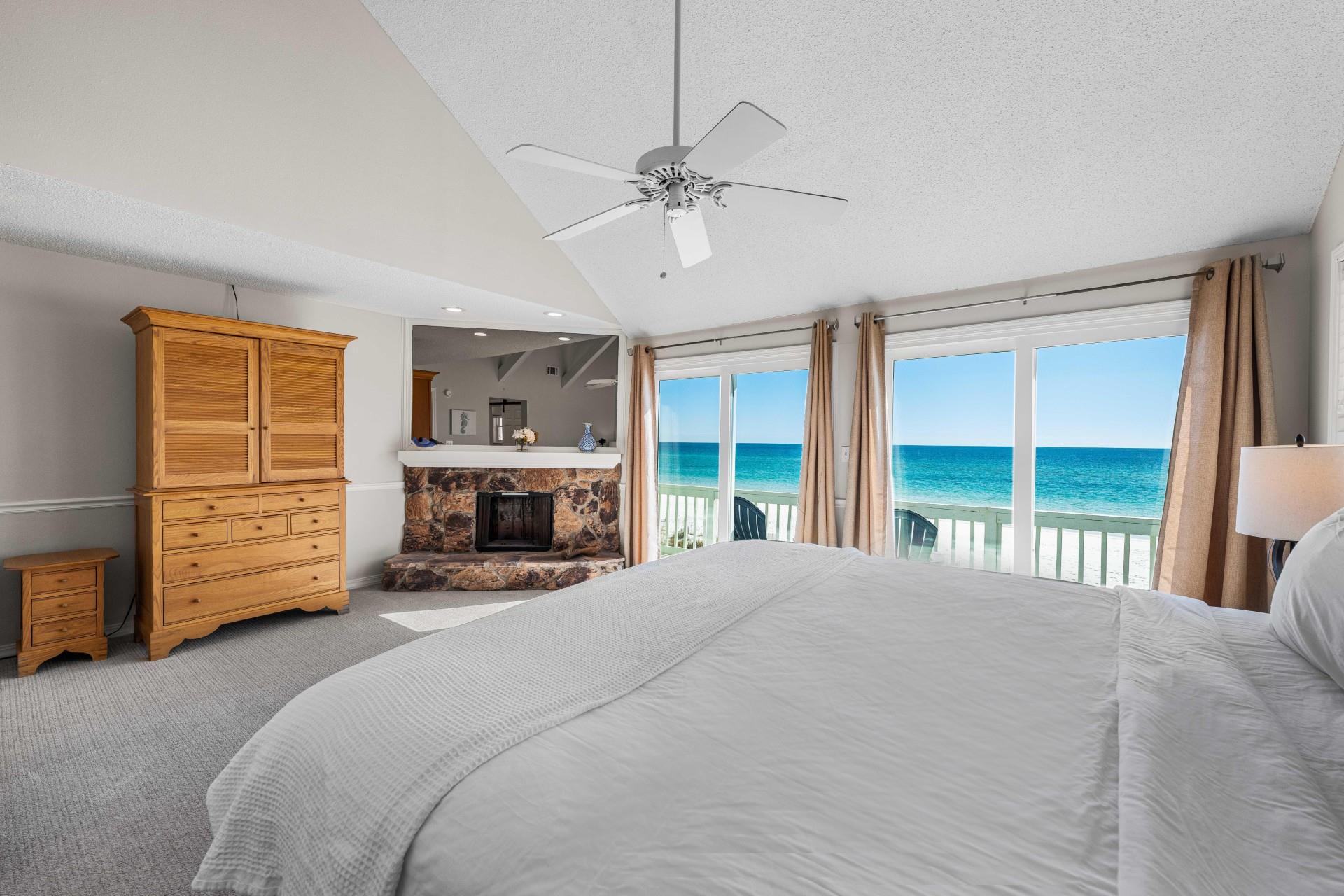 Beachfront primary king bedroom with stunning Gulf views and your private balcony.  40 cable tv located inside the armoir.