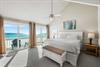 Beachfront primary king bedroom with expansive Gulf views and your private balcony.