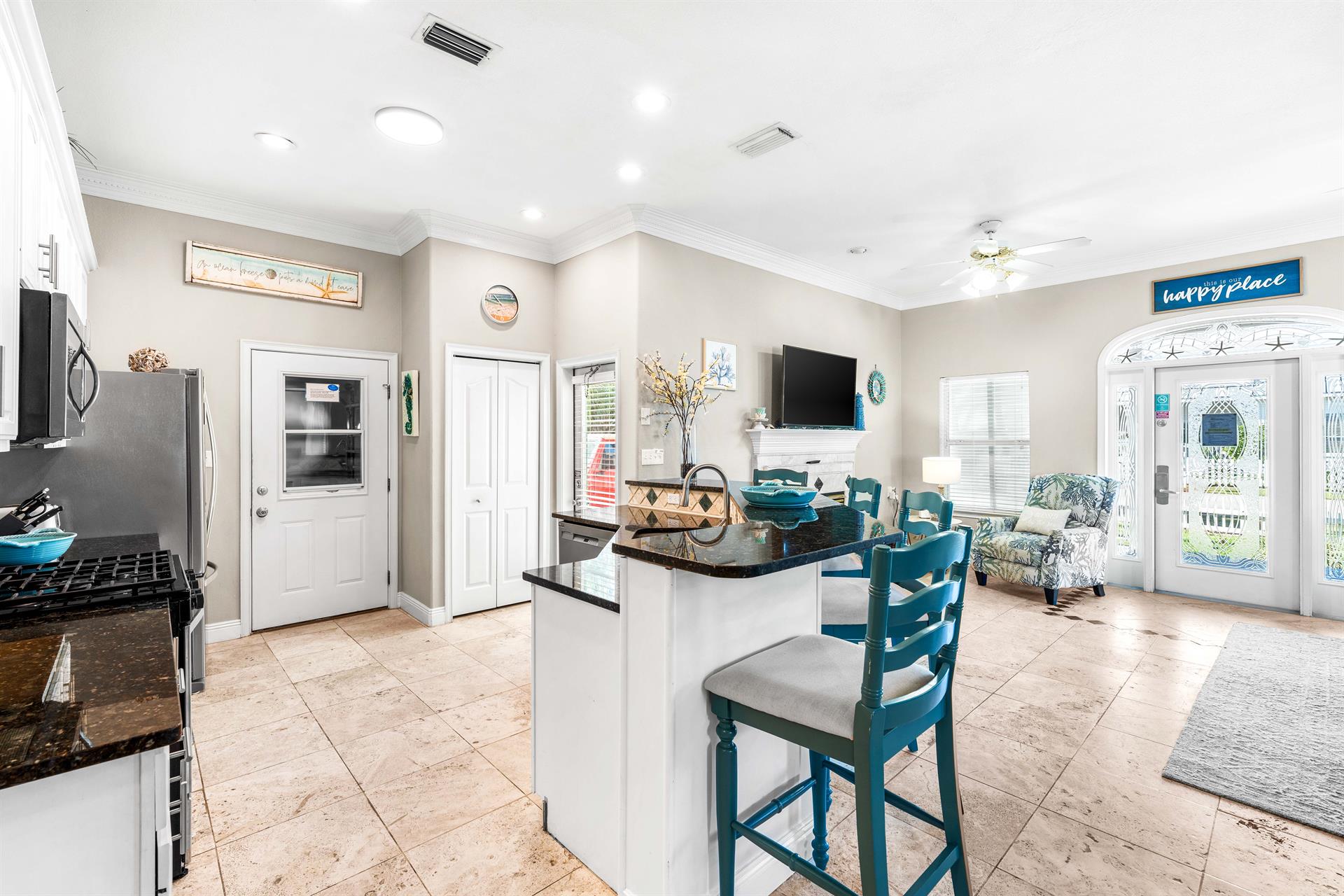 Fully Stocked Open Kitchen with Bar Seating for 4