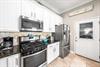 Gas range   Stainless steel appliances and granite countertops.
