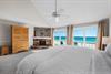 Beachfront primary king bedroom with stunning Gulf views and your private balcony.  40 cable tv located inside the armoir.