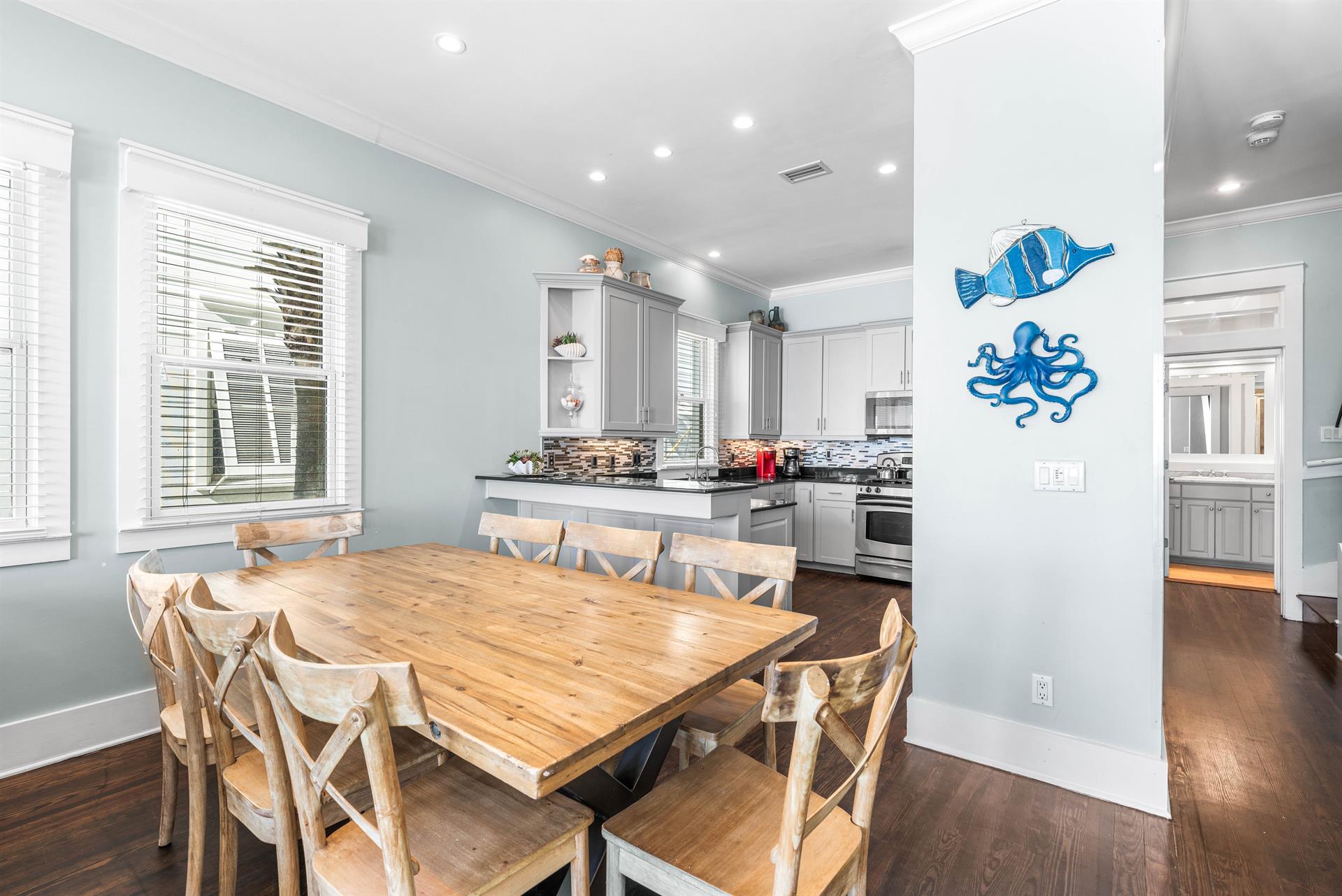 Just to the Right of the Kitchen is the Hallway leading to the Second Floor King Bedroom and Shared Guest Bathroom.