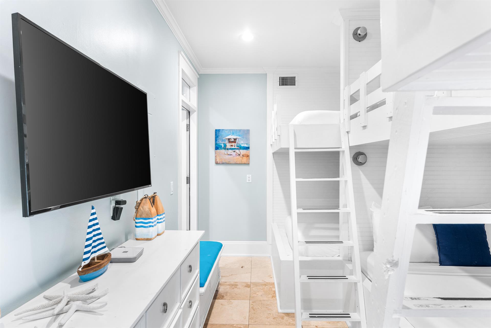 Three QueenoverQueen bunk beds With a 55 Smart TV.