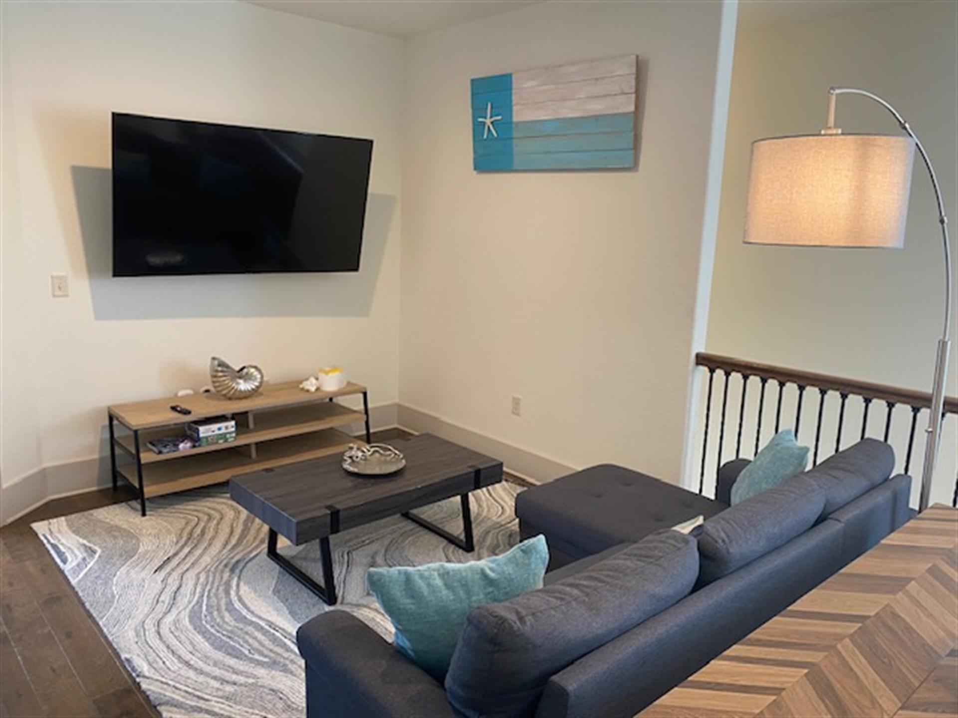 2nd floor bonus living area with kids in mind  Table for 6 perfect for games or puzzles.  Sofa  65 Smart TV with Cable Also