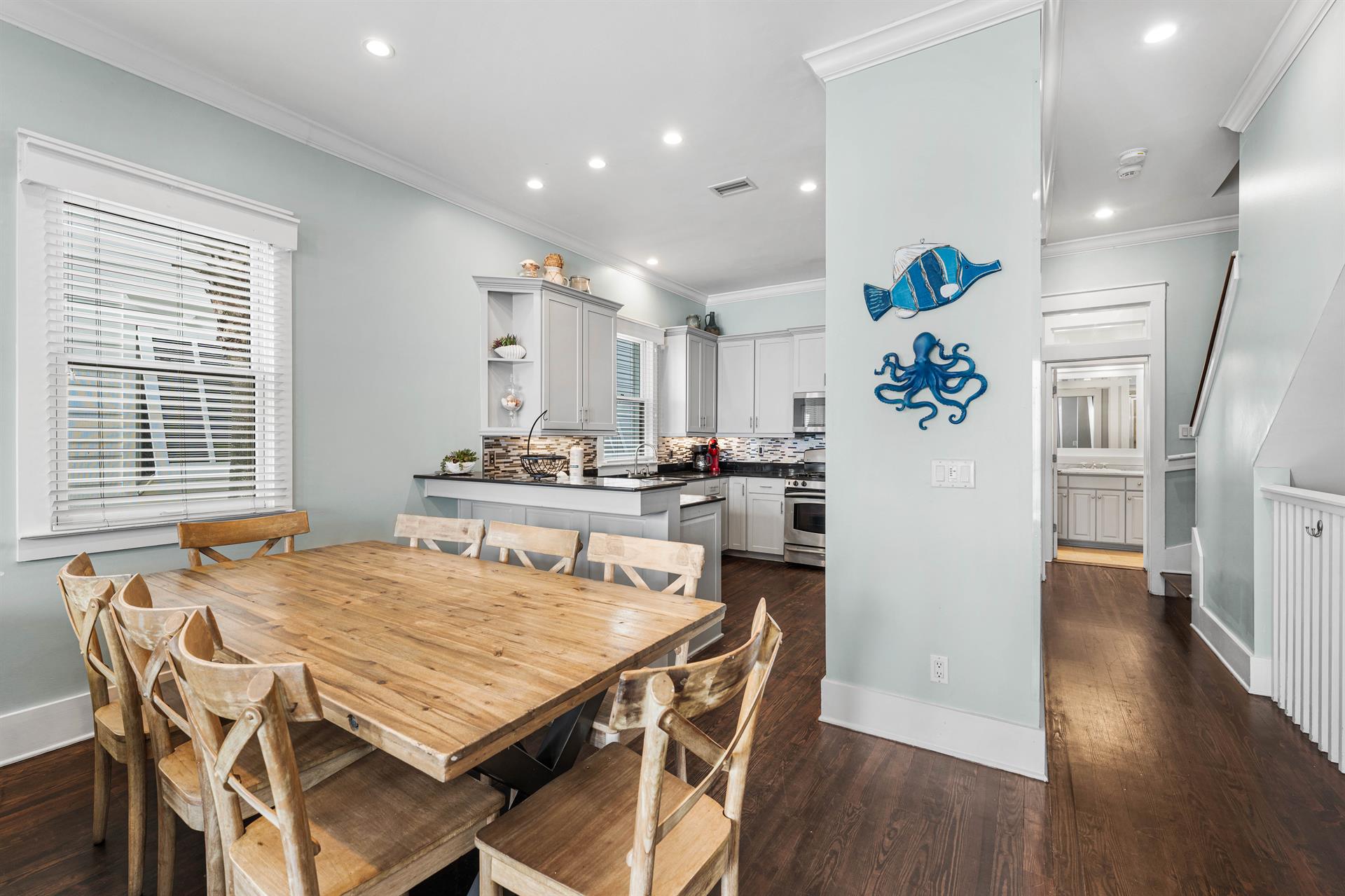 Just to the Right of the Kitchen is the Hallway leading to the Second Floor Guest King Bedroom and Shared Guest Bathroom.