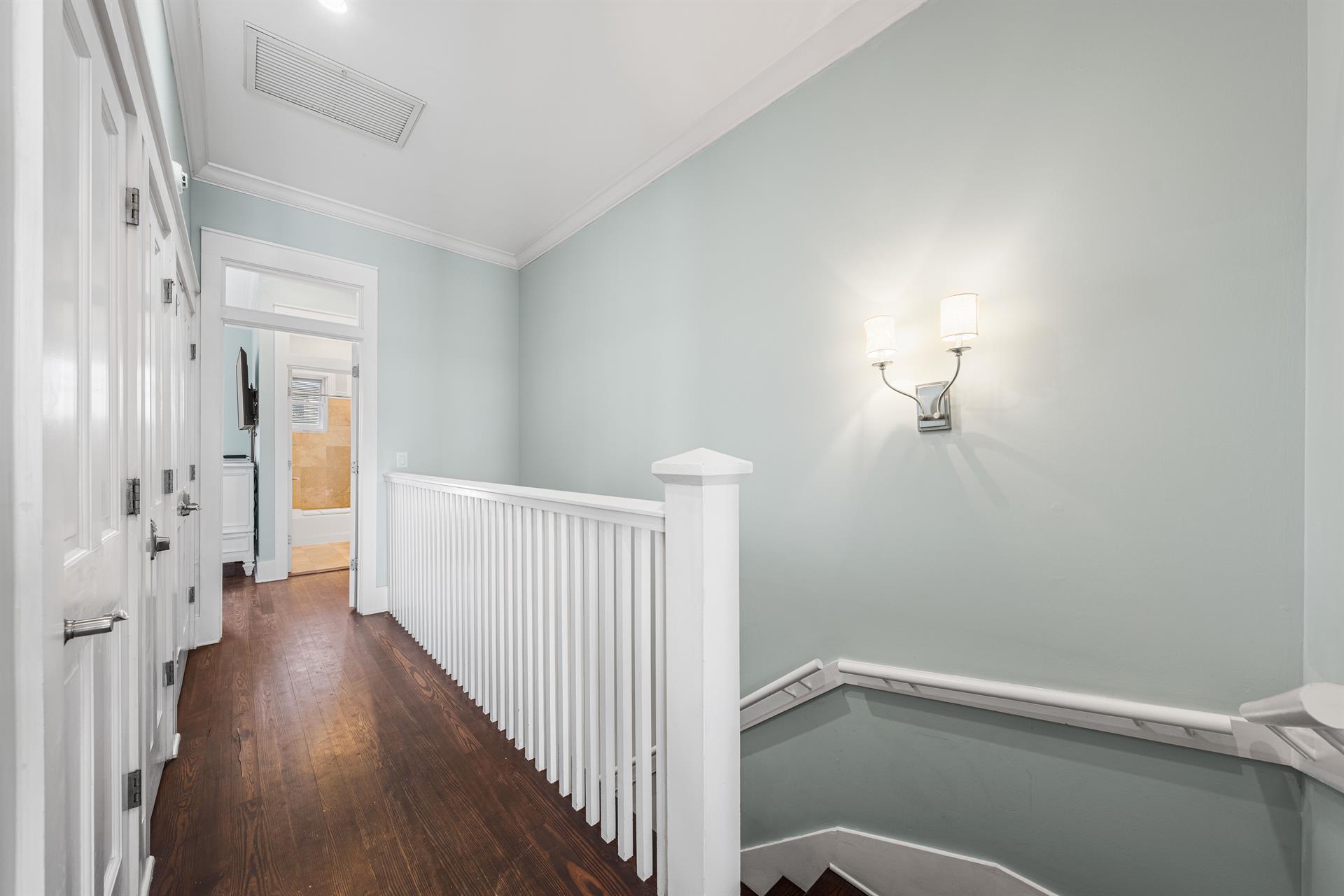 Stairs leading down to the Second Floor Living and Dining Area and Guest King Bedroom and Bath.