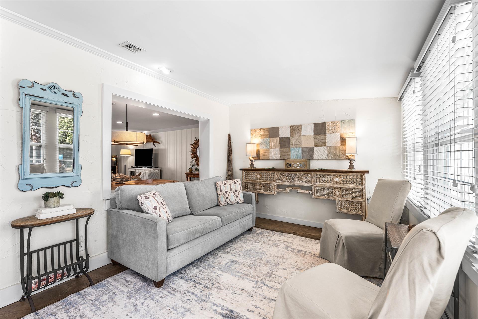 A traditional Florida Room in Seabreeze with a sleeper sofa, bar cabinet, a desk,  access to the pool area through French doors. safety alarm
Fully stocked Beach Gear closet