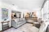A traditional Florida Room in Seabreeze with a sleeper sofa, bar cabinet, a desk,  access to the pool area through French doors. safety alarm
Fully stocked Beach Gear closet