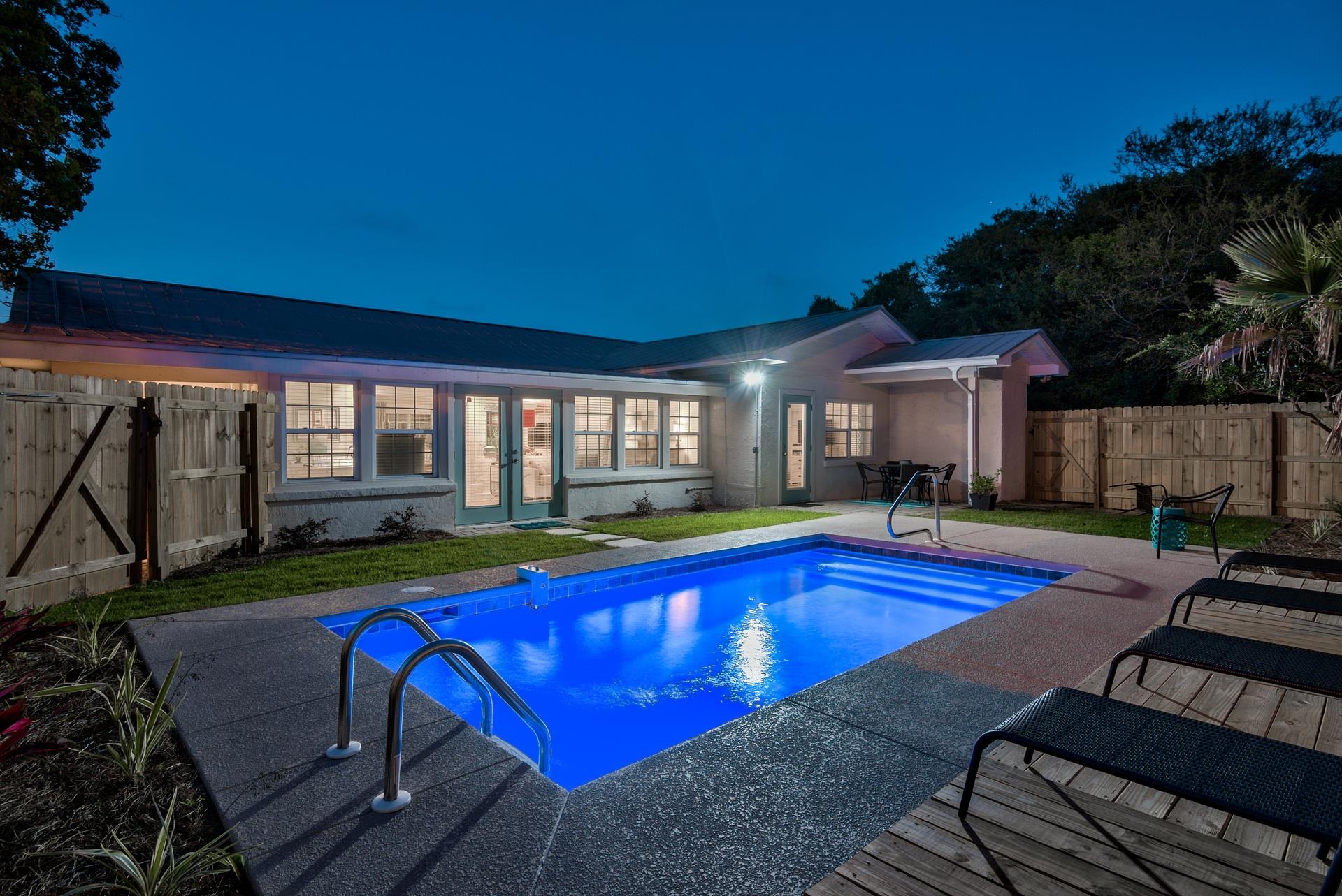 Private pool in the evening inside fenced backyard.  Seabreeze has 2 outdoor entertaining areas