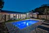 Private pool in the evening inside fenced backyard.  Seabreeze has 2 outdoor entertaining areas