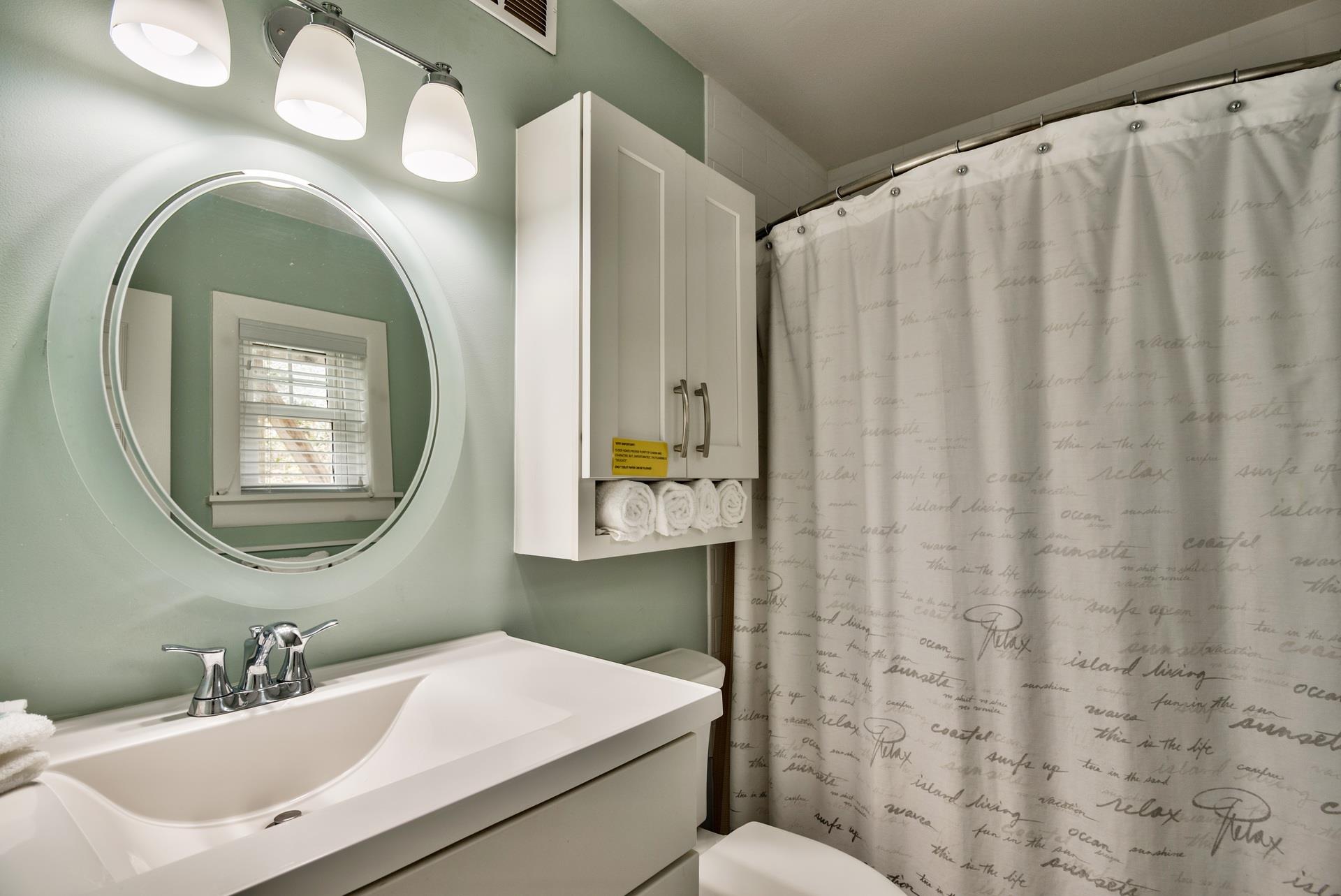 Primary bedrooms ensuite bathroom with a bathtubshower combination.