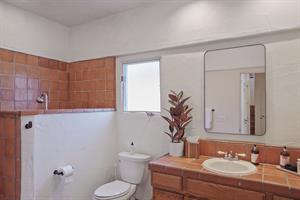 First Floor Bathroom with Tiled Step Down Shower.