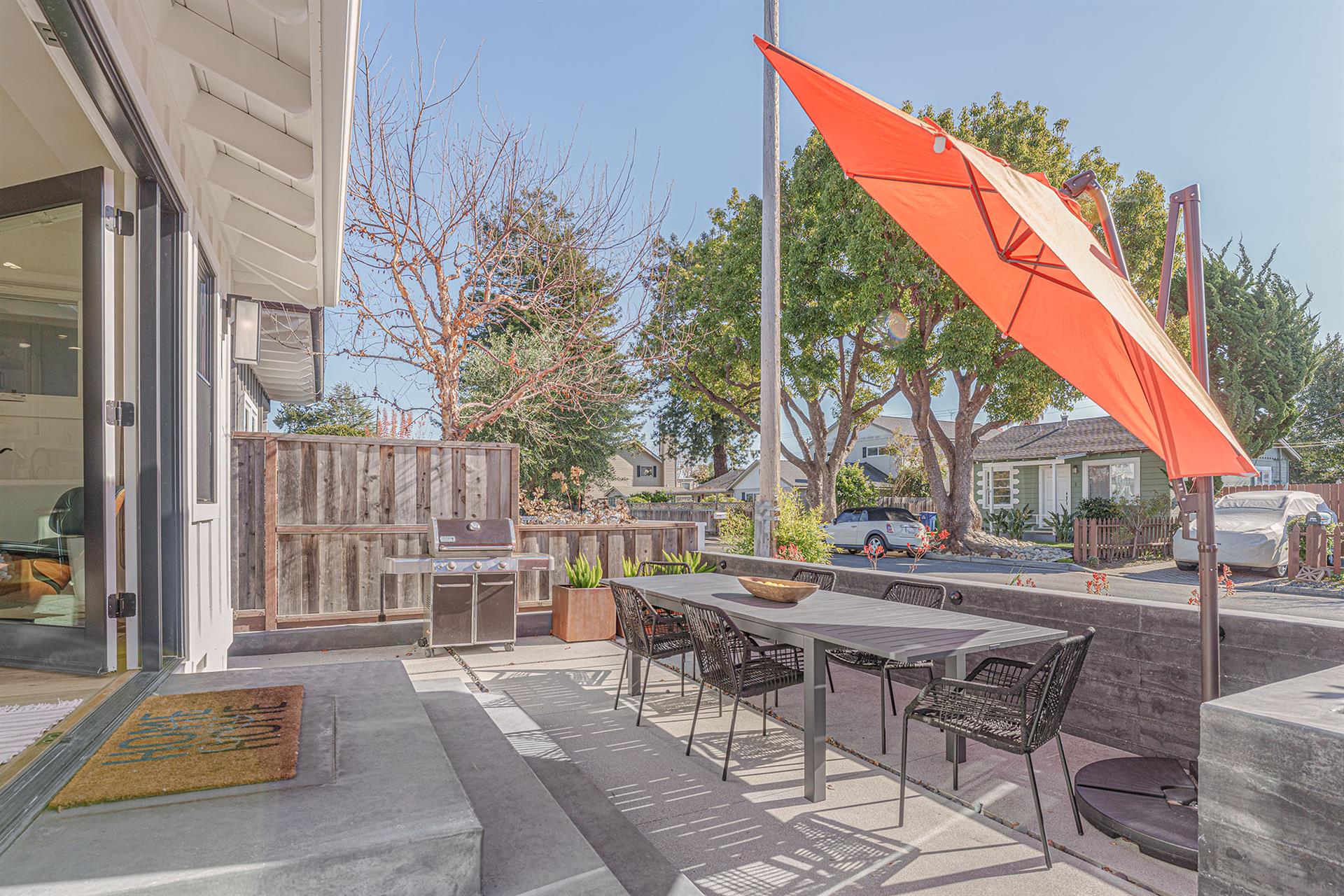 Front Patio has Dining Table and Gas Grill