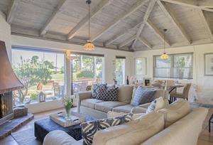 Living Room  Decorative Candle Lit Fireplace and Golf Course