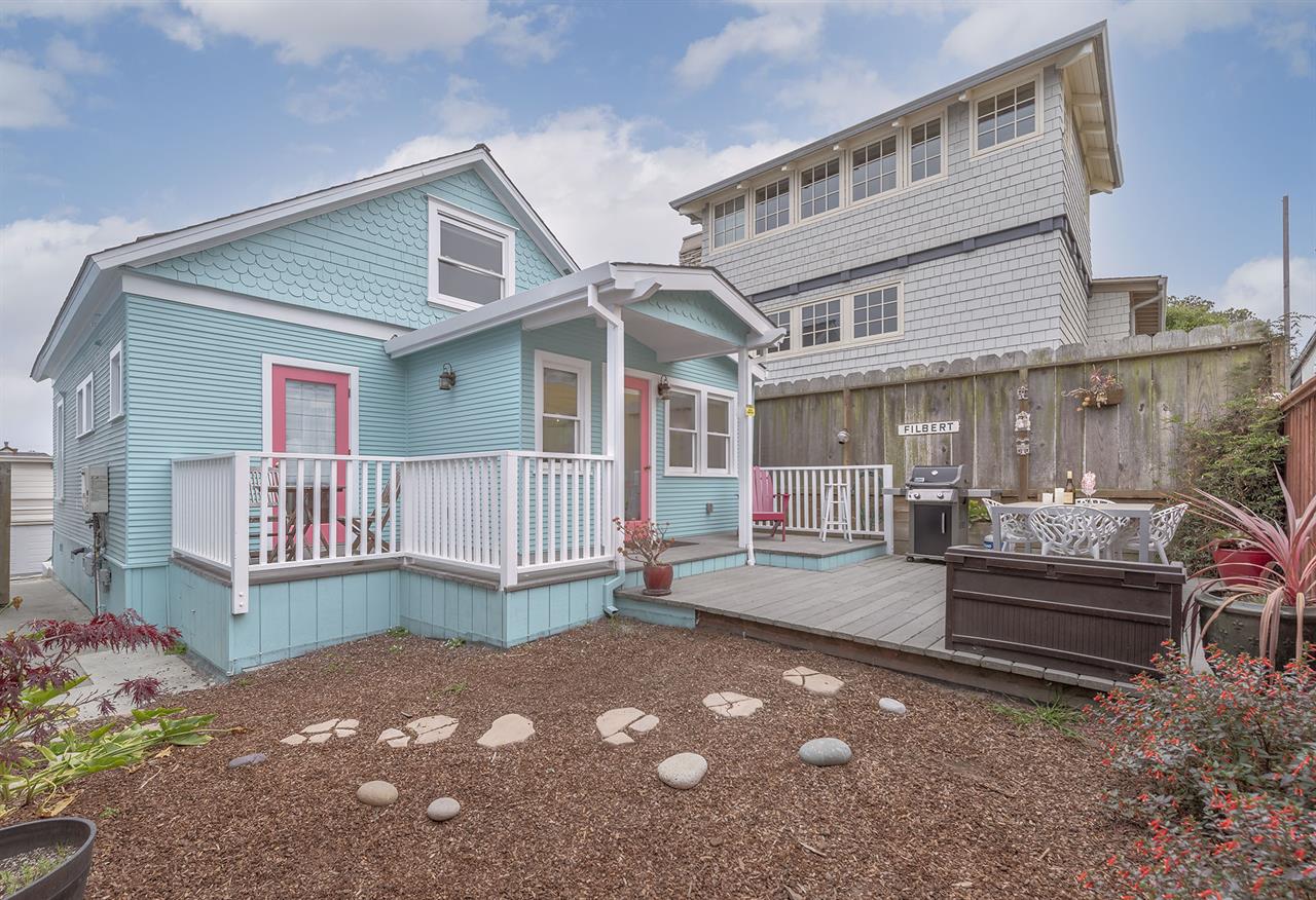 Backyard has a Gas Grill and Dining Area