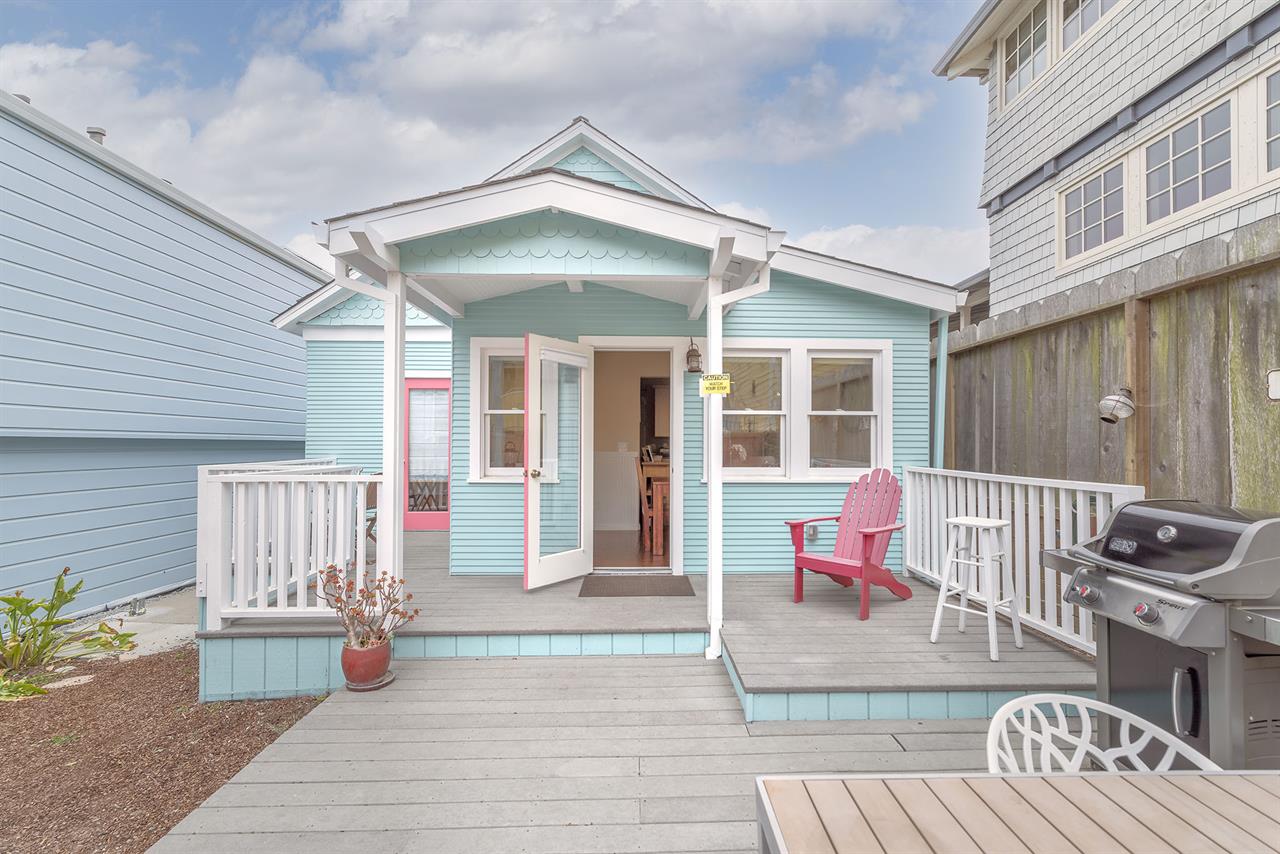 Backyard has a Gas Grill and Dining Area