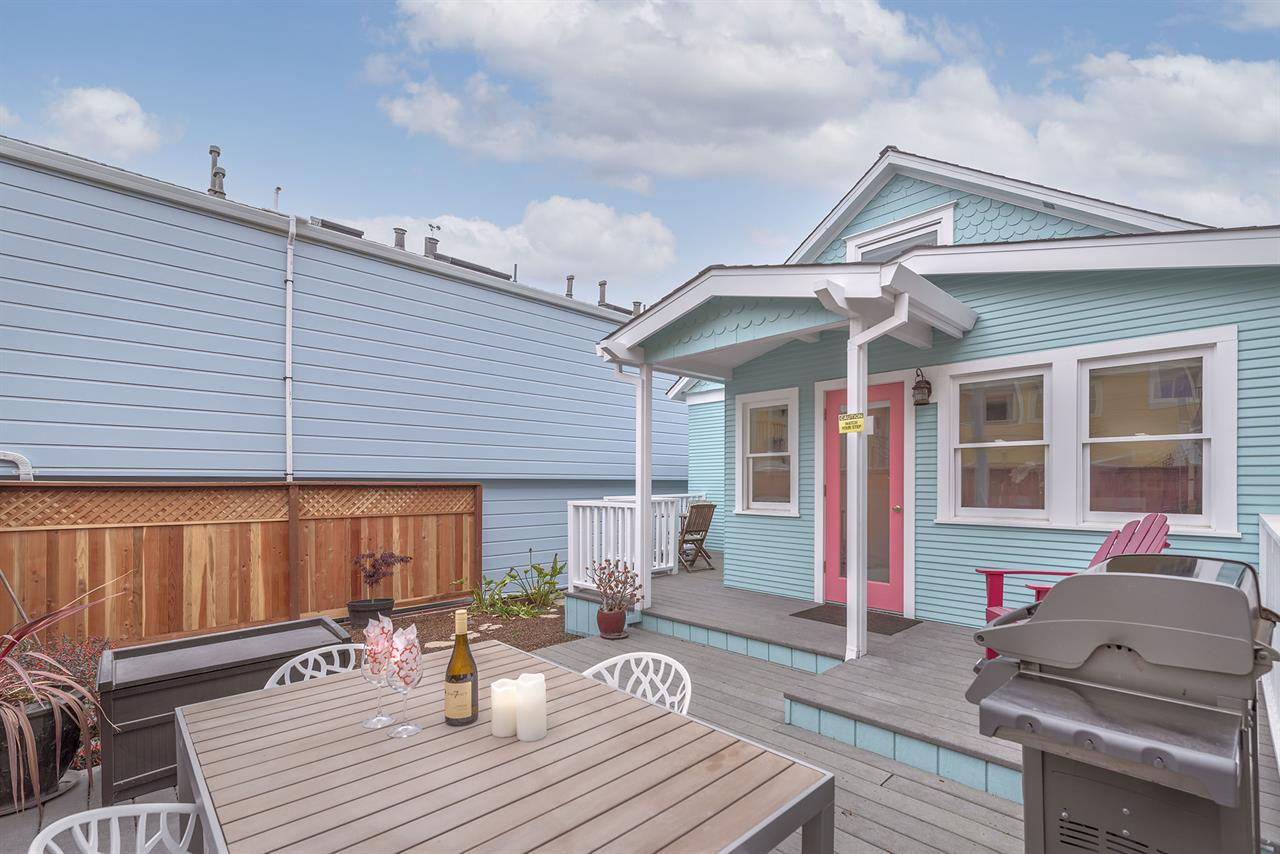 Backyard has a Gas Grill and Dining Area