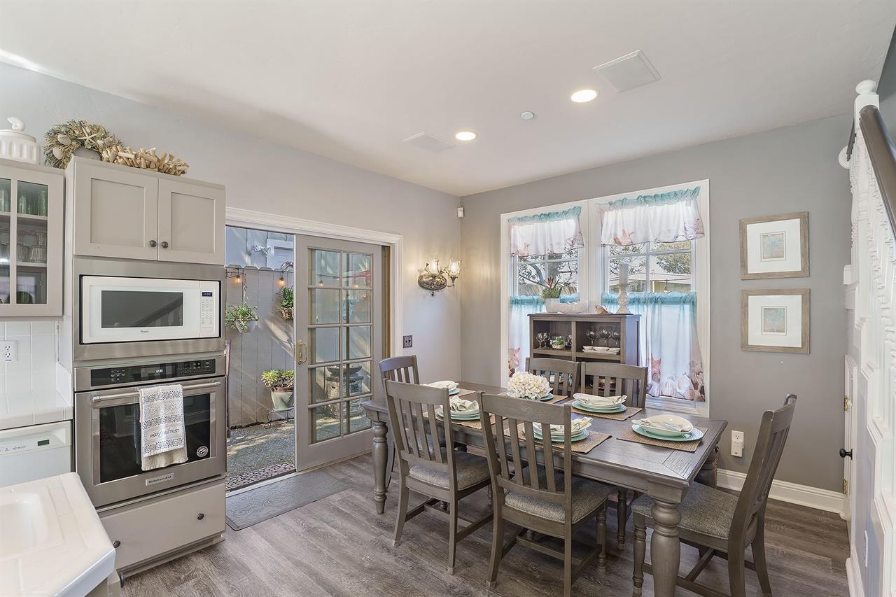 Kitchen and Dining Area with Back Patio Access