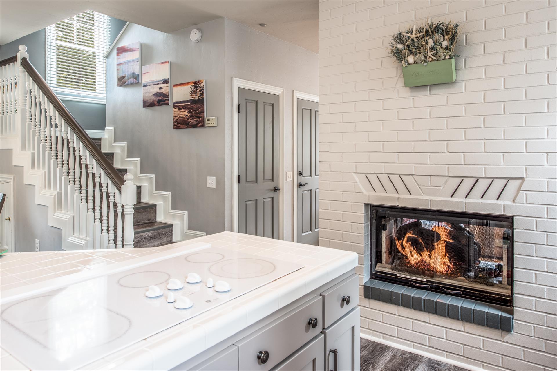 Kitchen Enjoys the TwoSided Gas Fireplace
