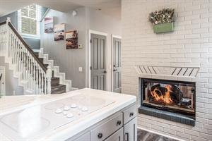 Kitchen Enjoys the TwoSided Gas Fireplace