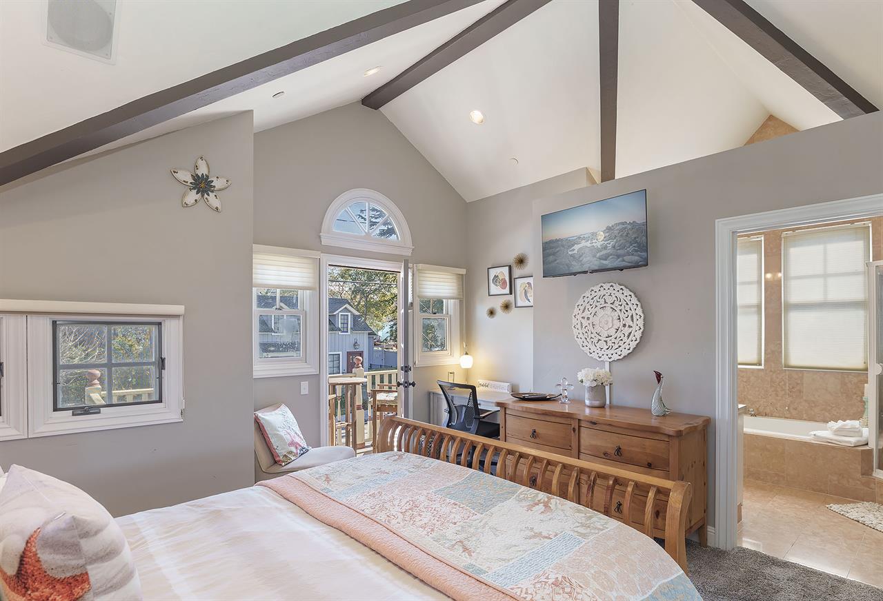 Bedroom 1 with Queen Bed, HDTV, Desk, Balcony