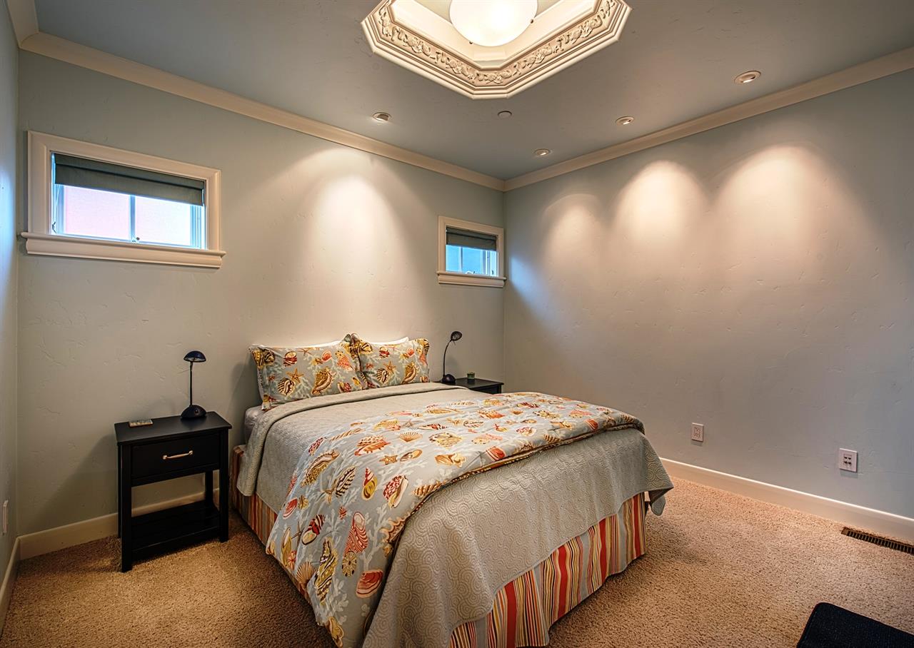 Downstairs Bedroom 4  Queen Bed and is Next to a Full Bath