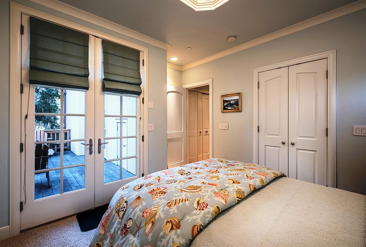 Downstairs Bedroom 1  French Doors Lead to Back Deck