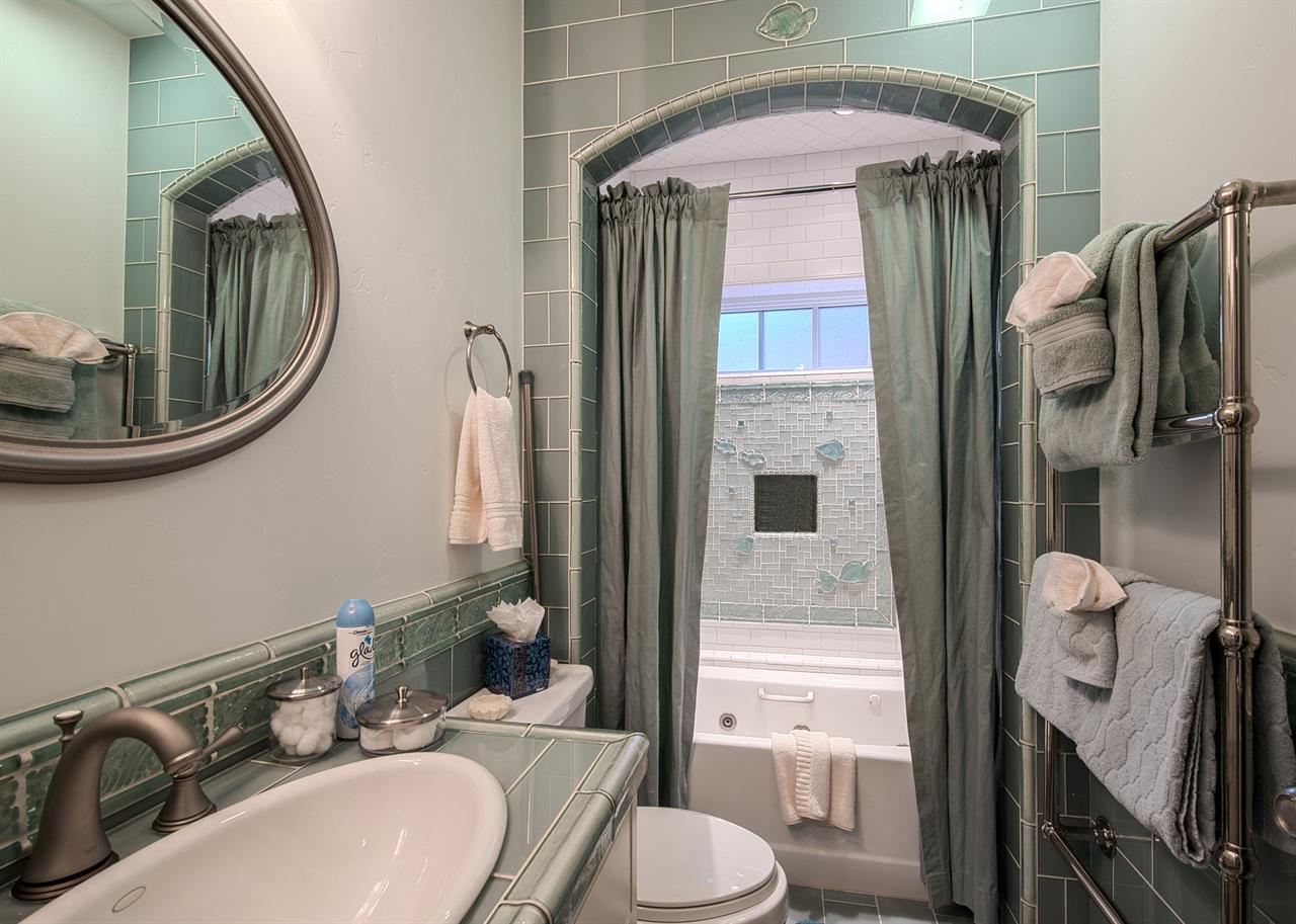 Full Hall Bath Downstairs with Towel Warmer and Spa Amenities