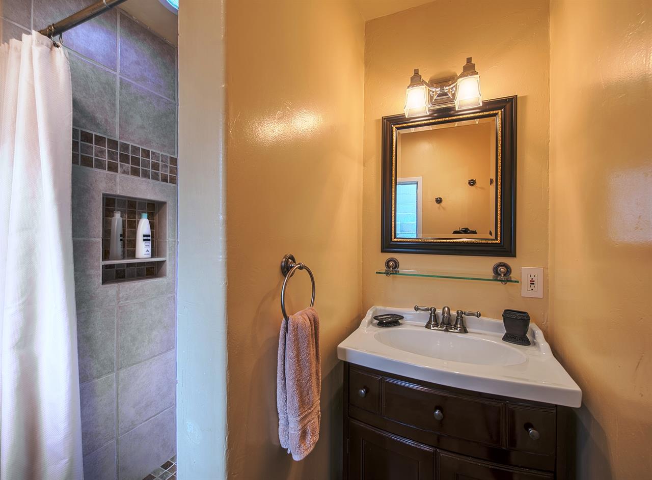 En Suite Bathroom has a Beautiful Travertine Tile Shower
