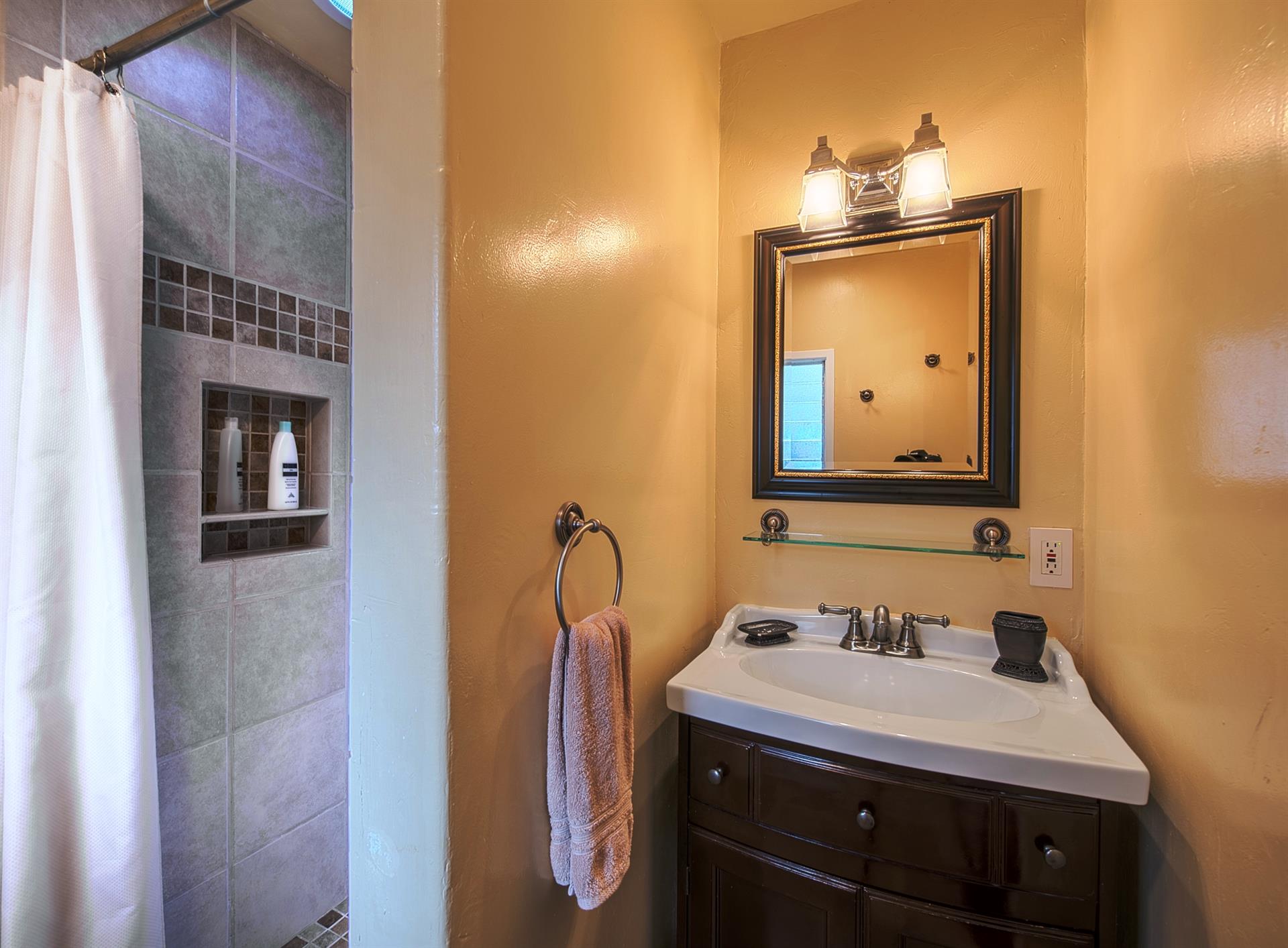 En Suite Bathroom has a Beautiful Travertine Tile Shower