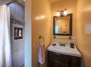 En Suite Bathroom has a Beautiful Travertine Tile Shower