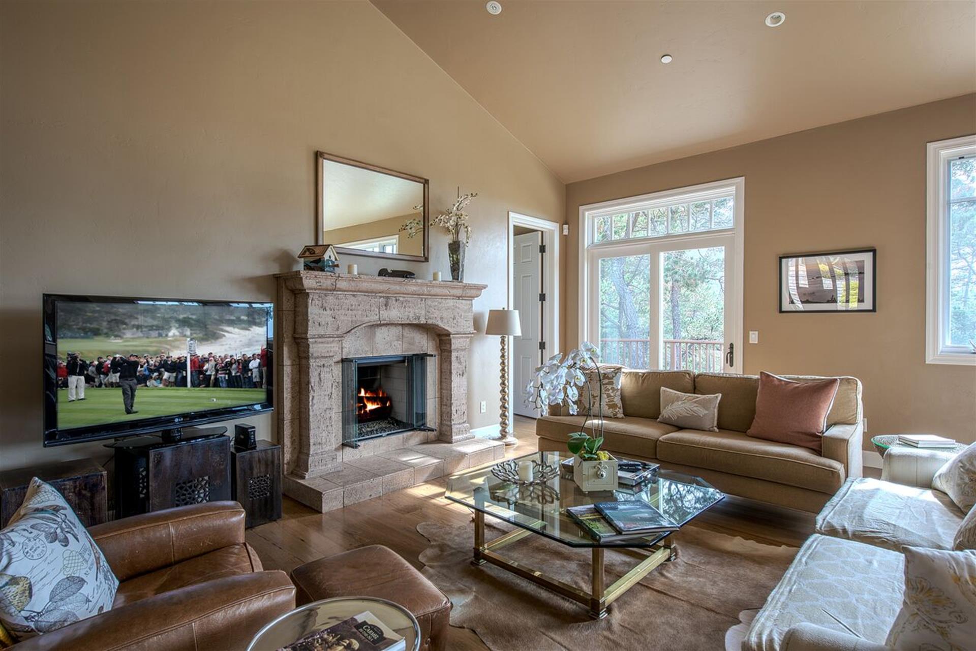 Spacious Living Room with a Massive Stone Fireplace