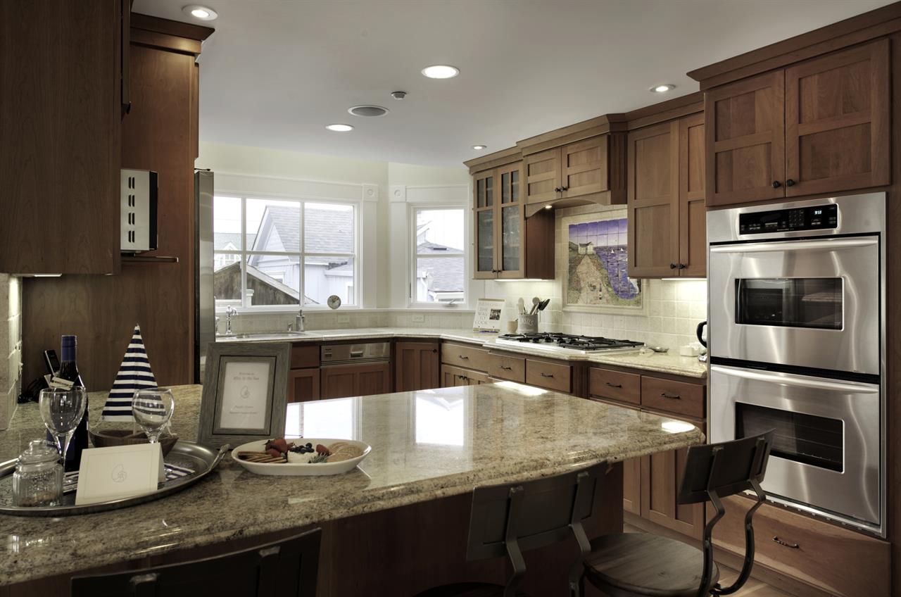 Kitchen has Granite Counters and Stainless Steel Appliances