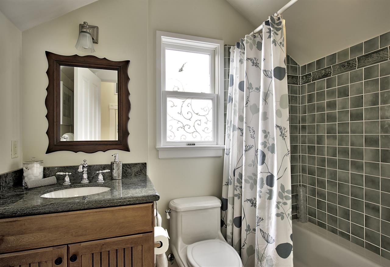 Upstairs Guest Bathroom with Shower Over Tub