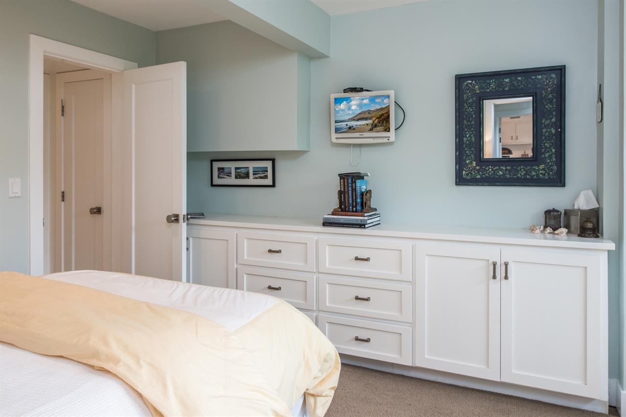 Bedroom 3 has a Queen Bed, TV, Access to Jack and Jill Bath