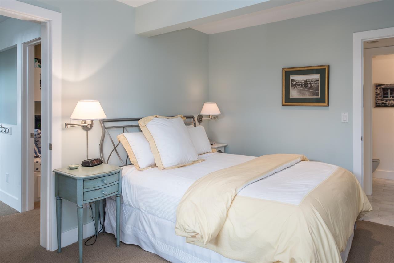 Bedroom 3 has a Queen Bed, TV, Access to Jack and Jill Bath