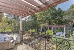 Balcony Outside Bedroom 1 Overlooks the Back Yard