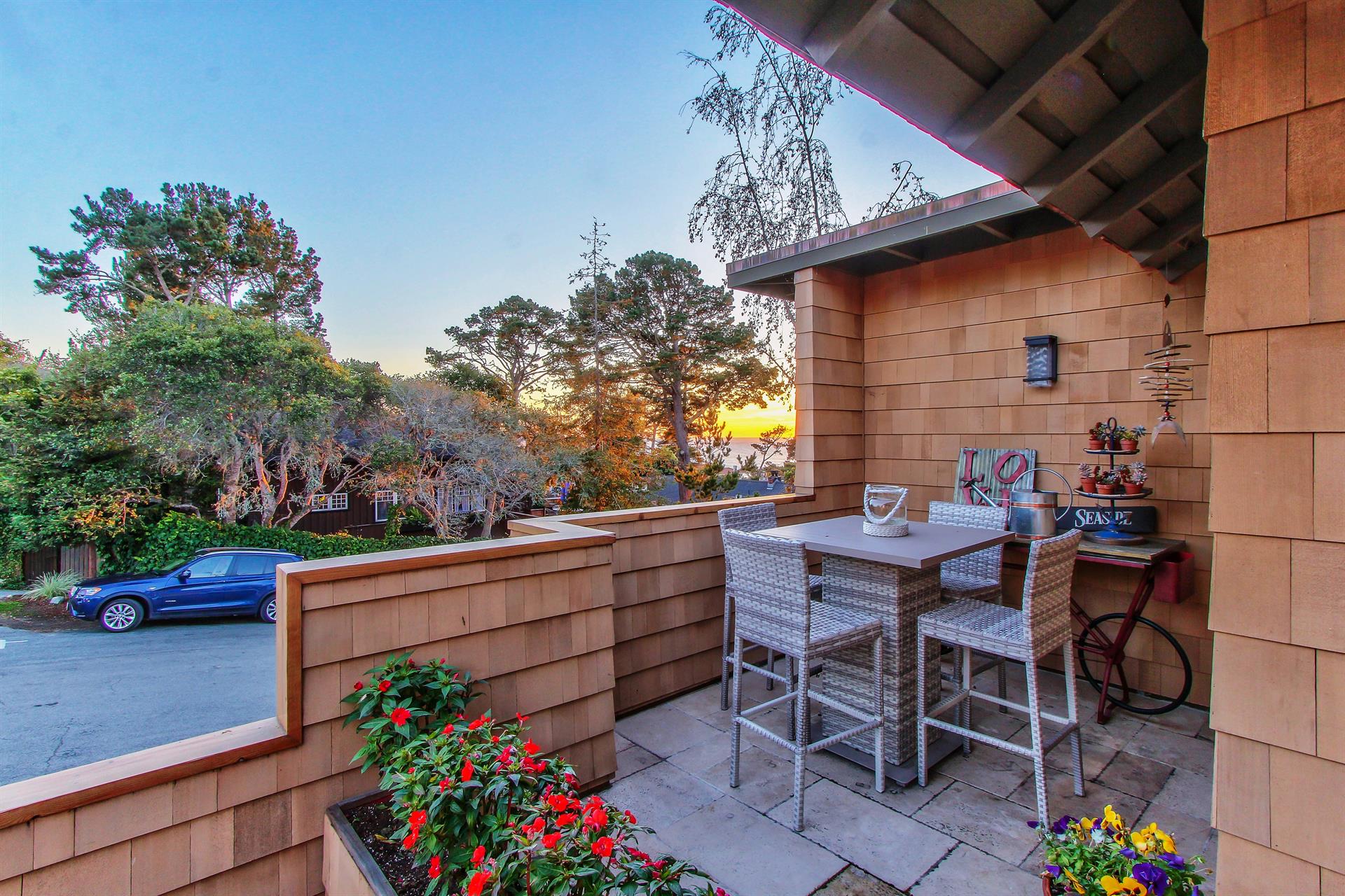 Outdoor Dining with a Distant Ocean View at Sunset