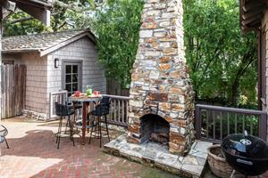 Side Patio has a WoodBurning Fireplace and Gas Grill